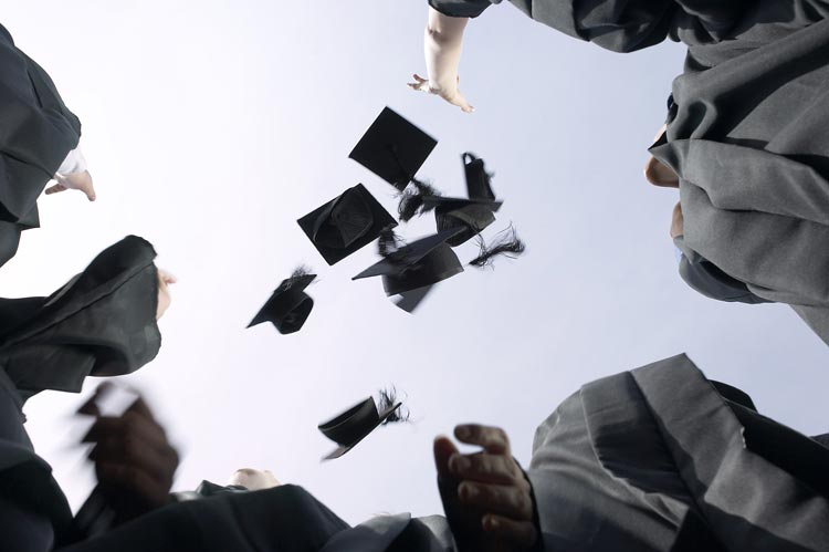 Students throwing caps